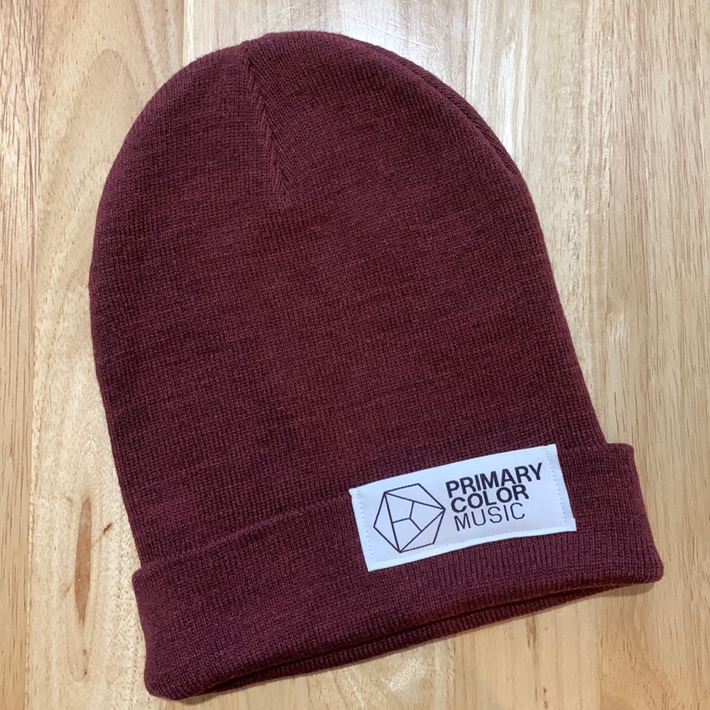 Primary Color. Music.  long maroon cuffed beanie. Winter hat